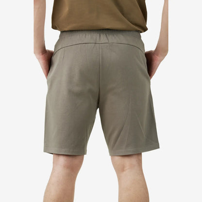 Back view of grey casual shorts featuring an elastic waistband, a smooth back design without pockets, and a relaxed fit.